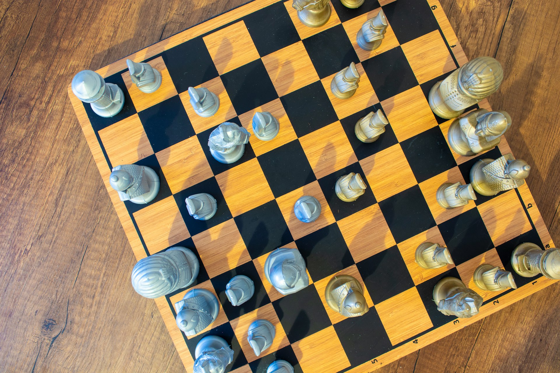 A chess board with a lot of chess pieces on it