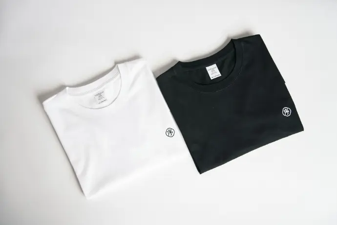 two black and white shirts sitting next to each other